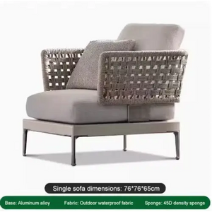 Close up of woven rattan texture on modular outdoor sofa set with cushions and aluminum frame