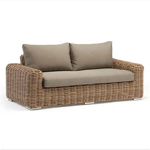 Outdoor wicker rattan sofa set showing detailed woven texture and contemporary design for garden patio spaces.