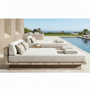 Teak outdoor sofa set with waterproof cushions arranged in full garden furniture configuration