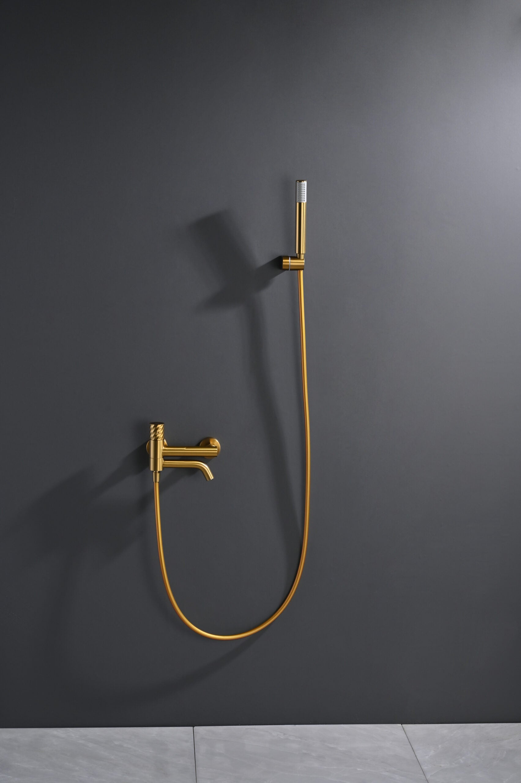 Bless Brushed Gold Single Lever Bath and Shower Kit, in a bathroom setting