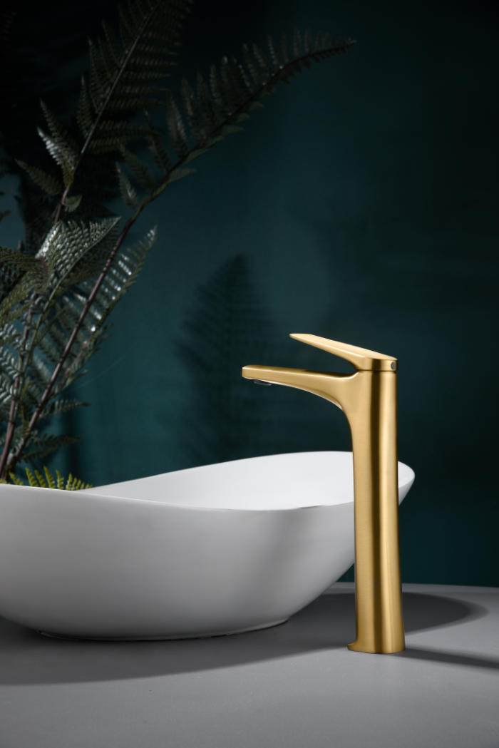 Delos Brushed Gold Tall Basin Mixer Faucet, in a bathroom setting