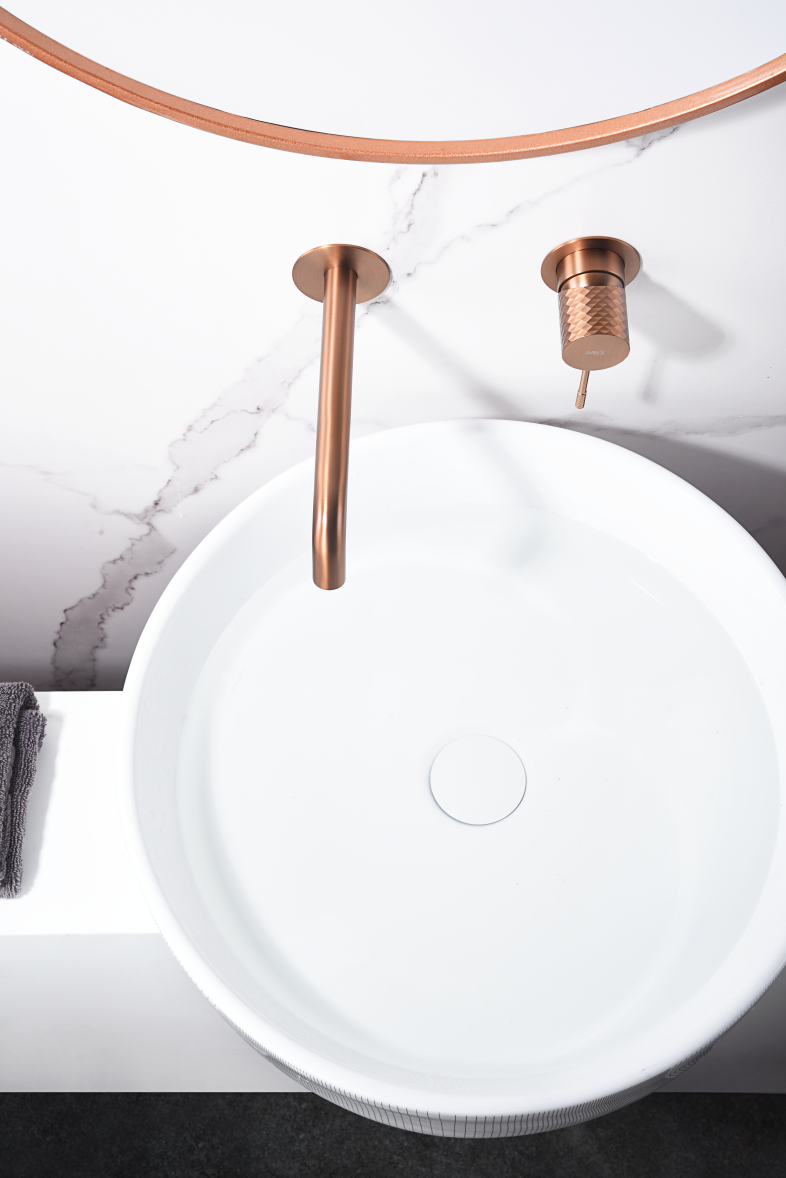Genova Brushed Rose Gold Basin Mixer Faucet, in a bathroom setting