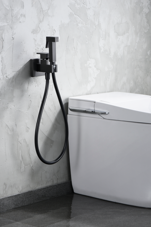 Gun Metal Built-In Bidet Faucet with Pop-Up Drain, in a bathroom setting