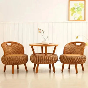 Bamboo rattan outdoor patio set showing natural woven material texture and craftsmanship detail on chair frame