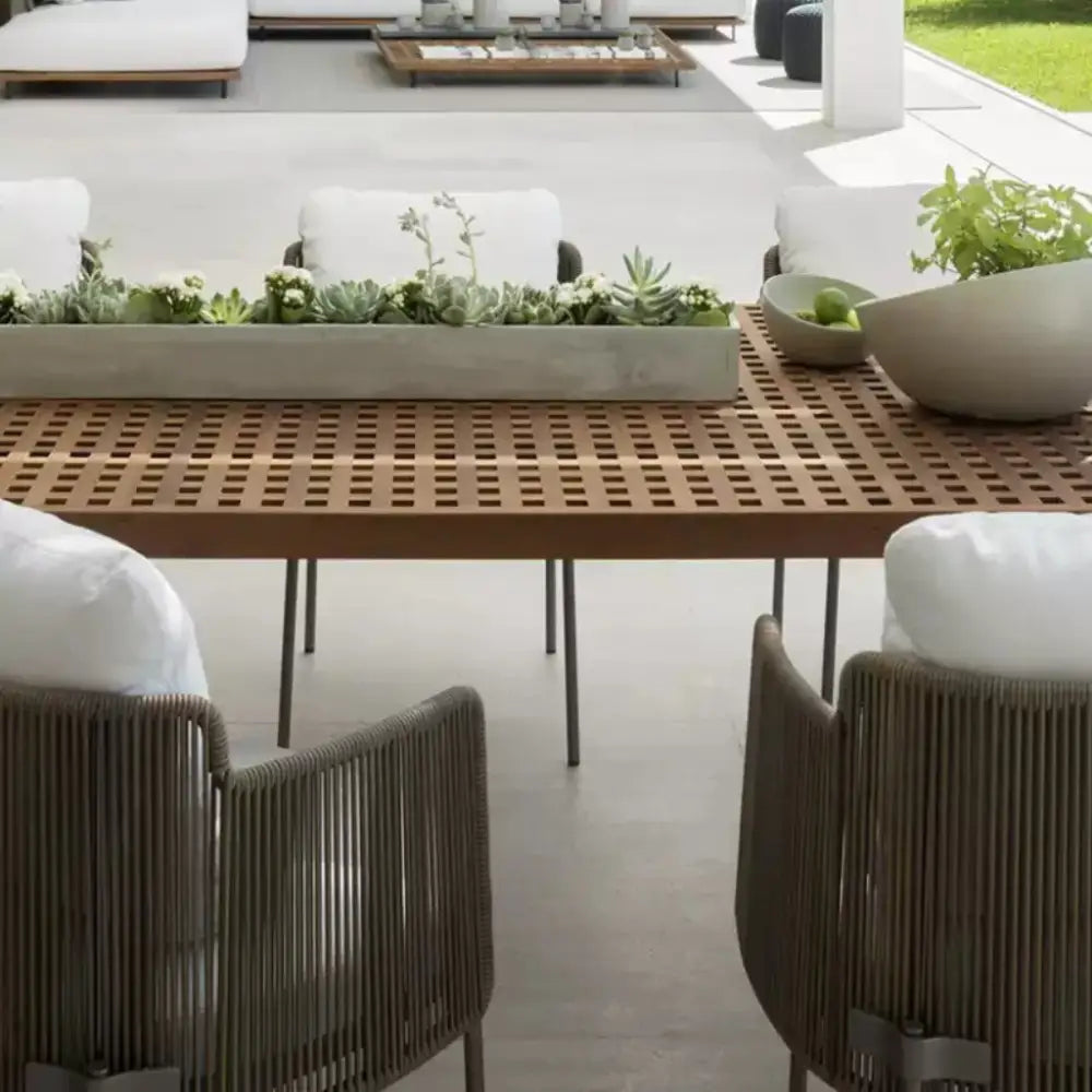 Close up of teak wood grain and natural finish on modern minimalist outdoor dining furniture