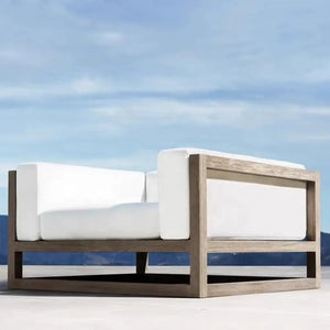 Close up of weather resistant brown rattan weave and sturdy aluminum frame detailing on sectional sofa