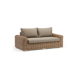 Close up of wicker rattan weave texture on outdoor patio sofa set showing material quality and craftsmanship detail