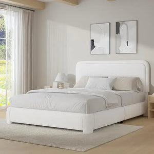 Queen platform bed with rounded bouclé headboard in cream finish