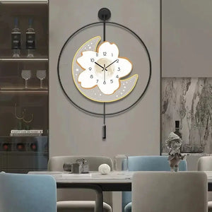 Moon and flower artistic wall clock with black border and golden accents