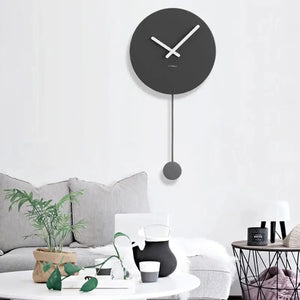 Black round minimalist pendulum wall clock with contemporary Nordic design