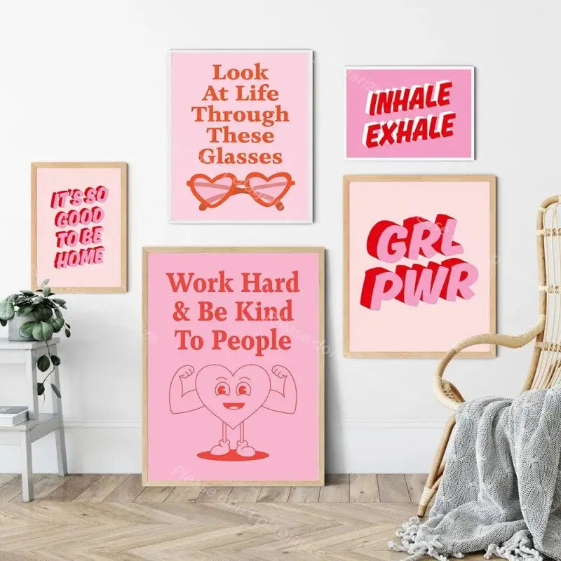 Pink canvas wall art displaying inspirational messages in modern decor style