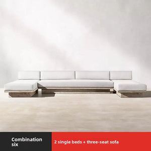 Teak outdoor sofa set showing waterproof cushion material and natural wood grain detail