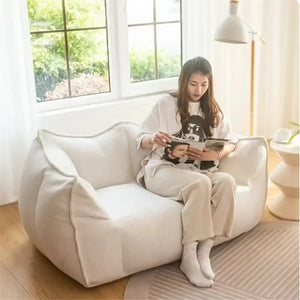 Gray compressed sofa with removable washable cover, compact furniture design