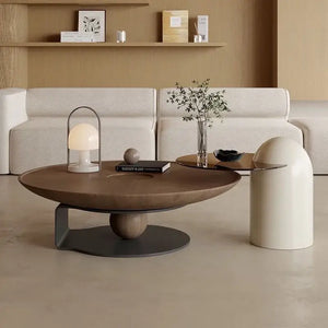 Brown wooden round modern coffee table with natural wood finish and grain detail